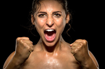 Isolated female athlete gives champion yell and victorious celebration after win - Powered by Adobe