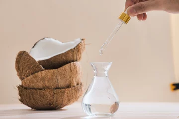 Fototapeten Healthy skincare. Pure coconut oil is made from organic coconut on wooden background © makistock