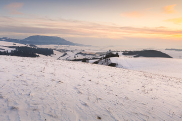 Turiec region and view of Velka Fatra mountain range in winter.
