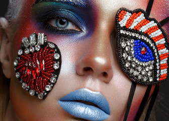 Beautiful girl with creative make-up in pop art style. Beauty face. Photo taken in studio