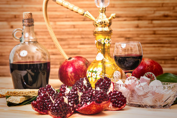 Still-life with Hookah, wine, garnet and sweets