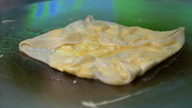 Banana pancake fried in hot pan in Thailand, Rotee of street food. 4k
