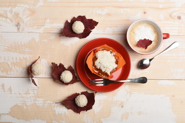 Coffee and dessert concept. Red ceramic tableware with beverage