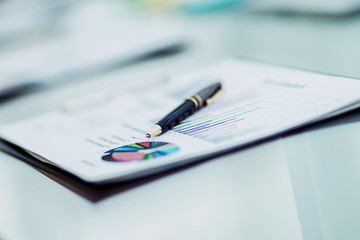  pen and financial documents on the table of the businessman