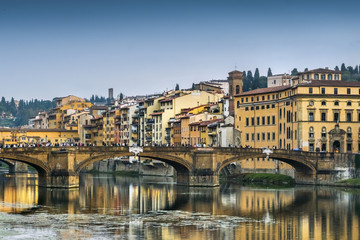 Fototapeta na wymiar Tourists on the bridge over the river Arno, Florence, Italy