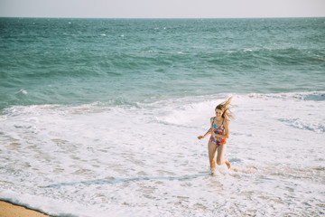 Fototapeta na wymiar Beautiful Young Woman Swimsuit Relaxing Ocean Beach