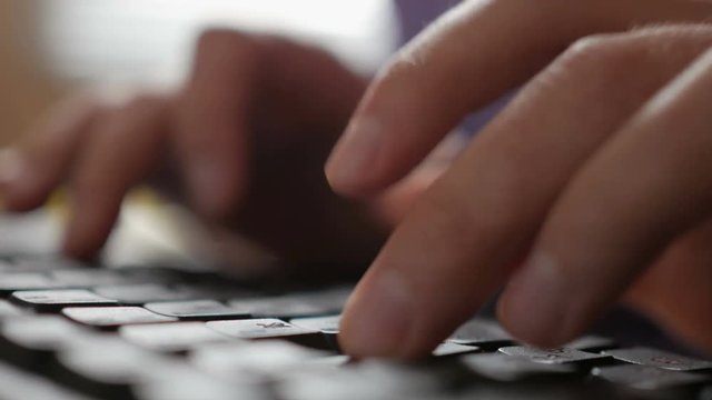 Closeup of businessman hand typing on computer keyboard. Men hands busy typing on a key board. Hacker student.