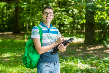 Obraz premium Image of a man with pencil in hand, wearing glasses