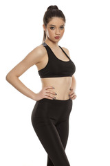 Fototapeta premium young woman in sportswear on white background