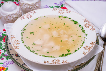 Chicken soup bouillon in a plate