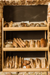 arious rural bread on shelves at pastry store