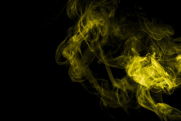 Yellow smoke on black background