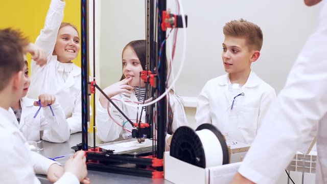 Children around 3D printer study modern technology