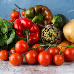Assortment of fresh italian vegetables on wooden table