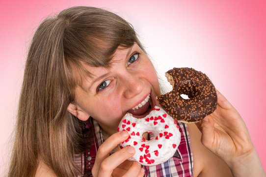 Funny girl with donuts in hands