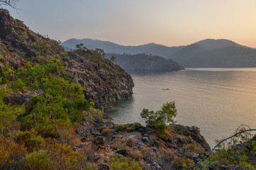 Fototapeta premium sunrise on the Mediterranean sea coast Maden Koyu, Cirali, Turkey