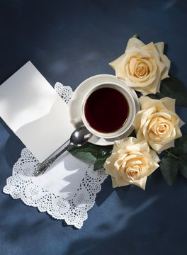 Fototapeta Morning cup of coffee and a beautiful flowers rose. The view from the top. Cozy Breakfast. Layout.