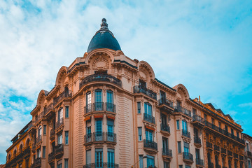 corner building with a small tower in vintage tint