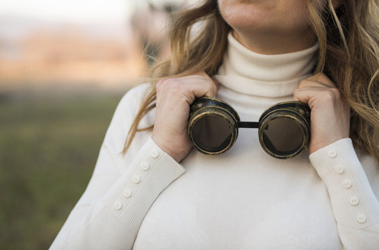Portrait of a woman with goggles around her neck