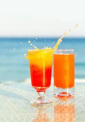 Two glasses of cocktail from freshly squeezed orange juice.