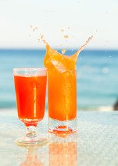 Two glasses of cocktail from freshly squeezed orange juice.