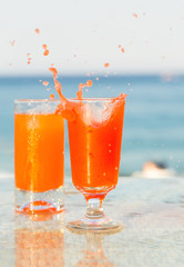 Two glasses of cocktail from freshly squeezed orange juice.