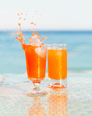 Two glasses of cocktail from freshly squeezed orange juice.