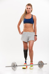 Full length portrait of a young disabled sportswoman