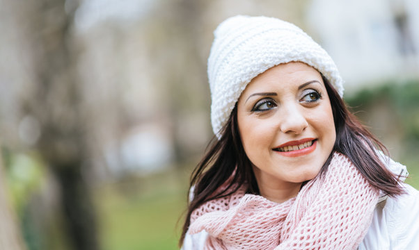 Portrait of smiling pretty woman wearing warm clothes