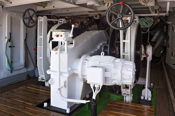 Steel anchor windlass on a sailing ship.