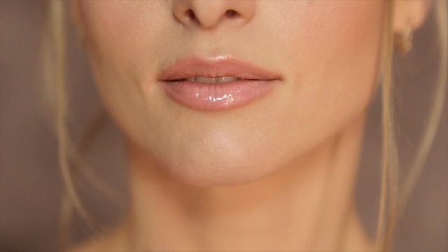 Women's lips, painted with light pomade