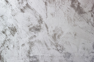 Vintage gray textured putty on wall. Rough grunge wall background.