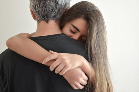 Teenage Girl Hugging Her Father