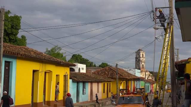 A man works on the eletrical system and infrastructure in the town of Trinidad, Cuba.