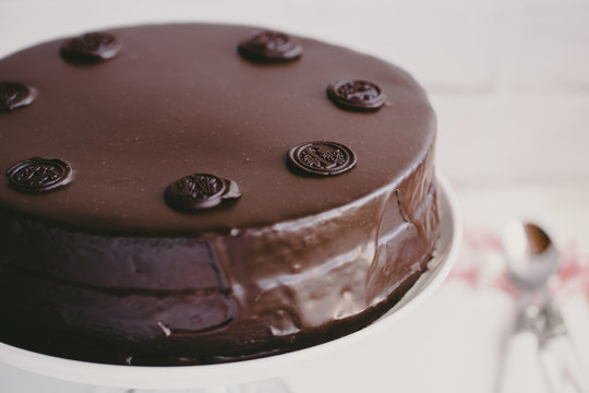 Close-up of a chocolate cake with chocolate glaze (sachertorte) on a cakestand	
