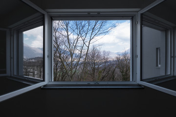 Fototapeta na wymiar Landscape seen from the private apartment window, open window