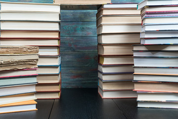 Stack books on wooden background. Back to school with copy space.