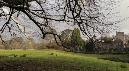 Obraz premium Rainbow touching the green fields in Killarney, Ireland