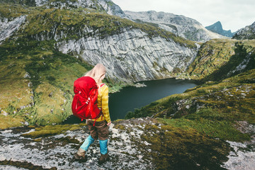 Naklejka premium Woman hiker with backpack trekking at mountains lake Traveling healthy lifestyle adventure concept active vacations outdoor