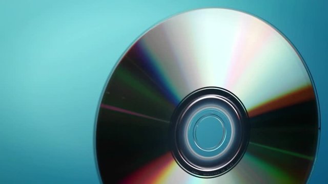 A DVD disc rotates.