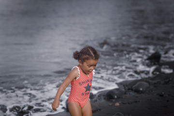 Fototapeta premium Happy girl jumping on the beach on the dawn time