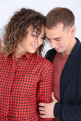 Portrait of young loving couple at home