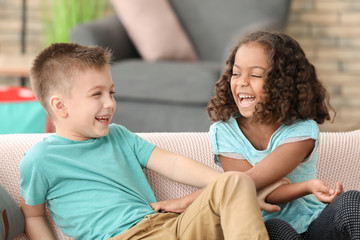 Fototapeta premium Cute children playing indoors. Child adoption