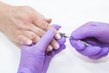 The process of the master's work in the manicure salon of female nails. 