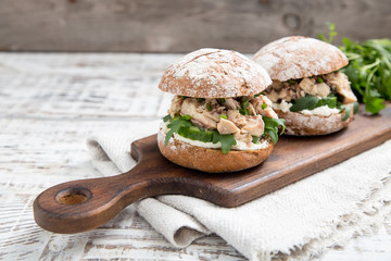 Food burger with tuna, herbs, cucumbers, cottage cheese, onions