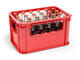 Bottles with soda or cola in the red strage crate for bottles.