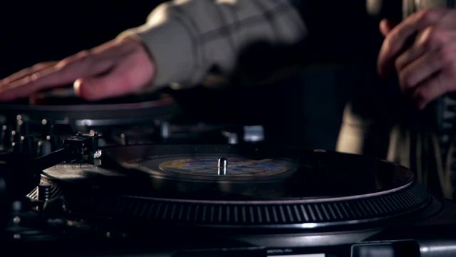 DJ plays vinyl. turntablism hip-hop style