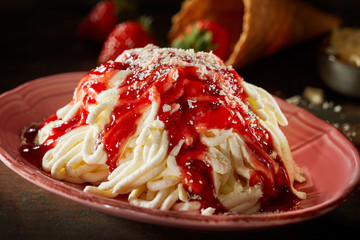 Ice cream noodles or ramen with berry syrup german called Spaghettieis