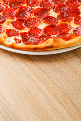 Pizza close up on a wooden table