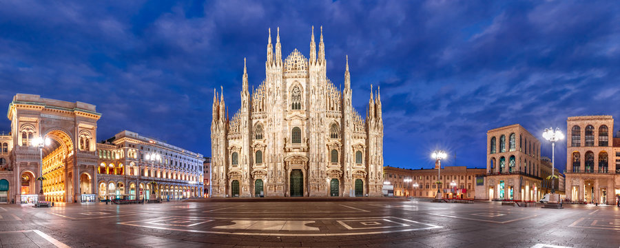 Fototapeta Panoramic view of piazza del Duomo, Cathedral Square, with Milan Cathedral or Duomo di Milano, Galleria Vittorio Emanuele II and Arengario, during morning blue hour, Milan, Lombardia, Italy